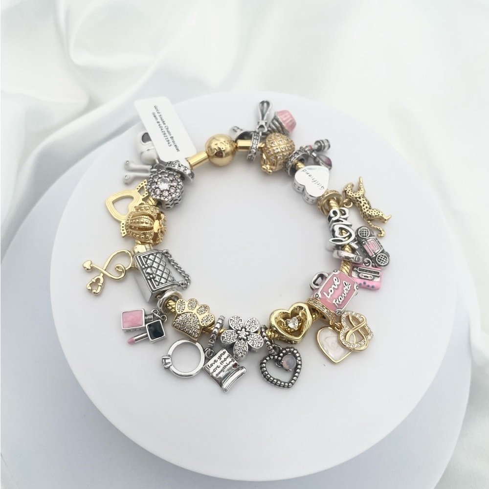 Linx Yellow Gold Bracelet with Gold Silver and Pink Nurse Girlfriend Charms